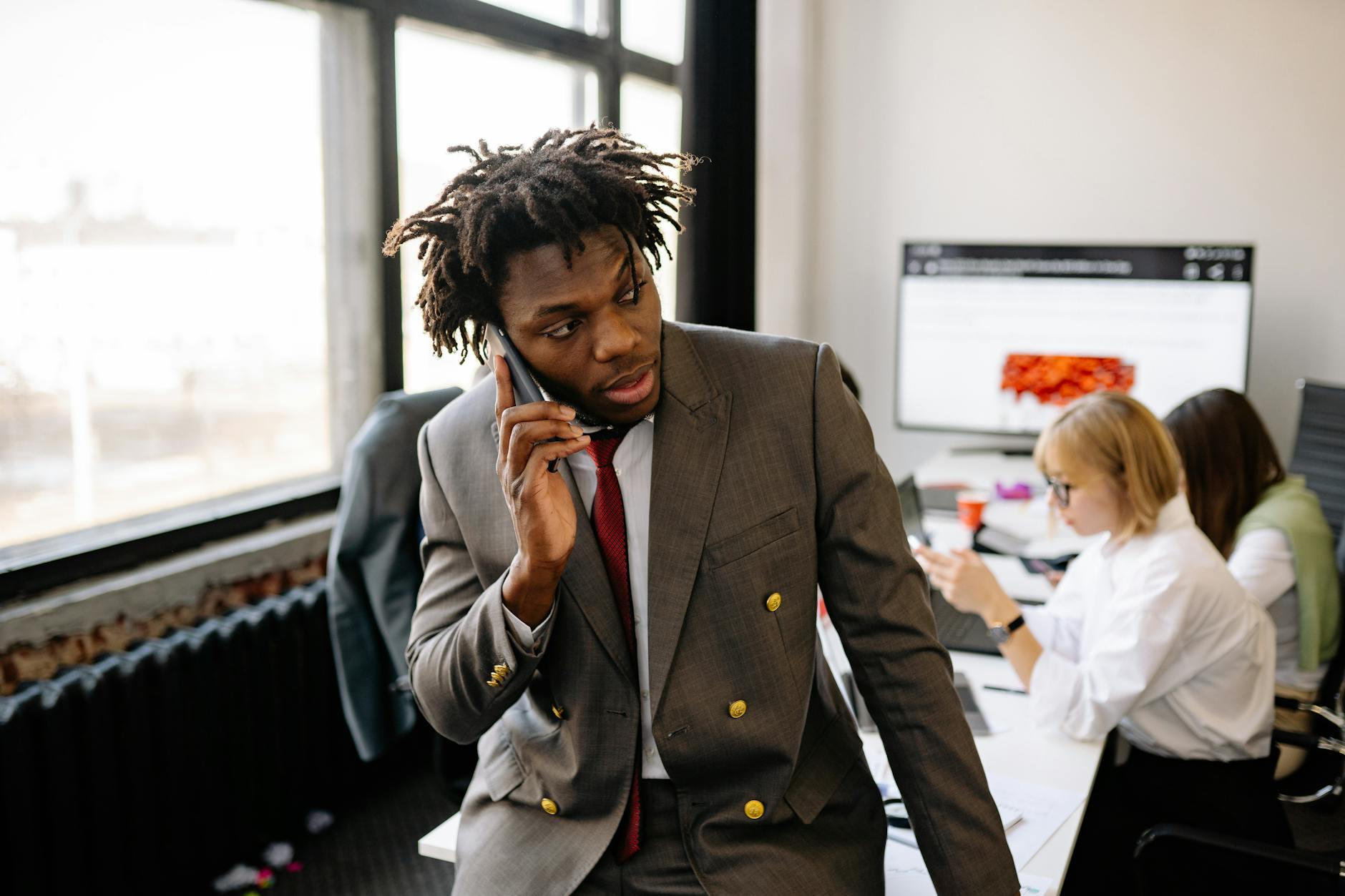 A busy professional working at a desk, representing focused deep work