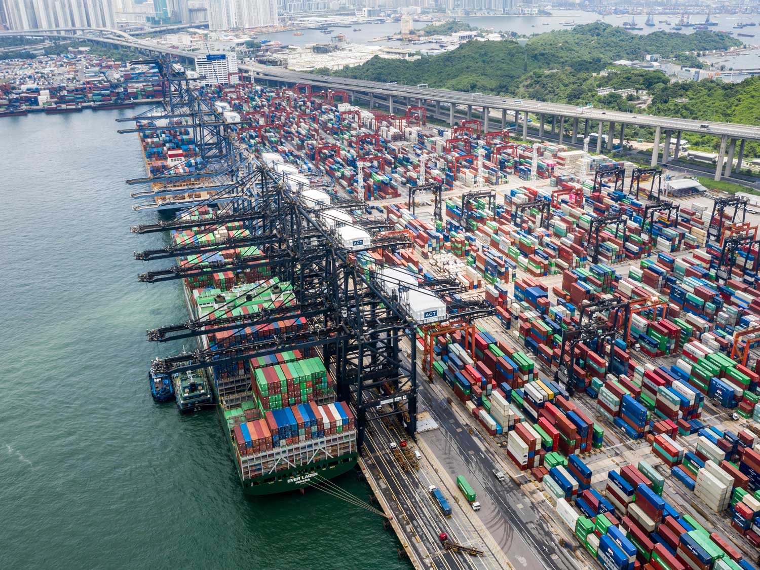 Hong Kong container port showing vessel congestion and stacked containers during peak season