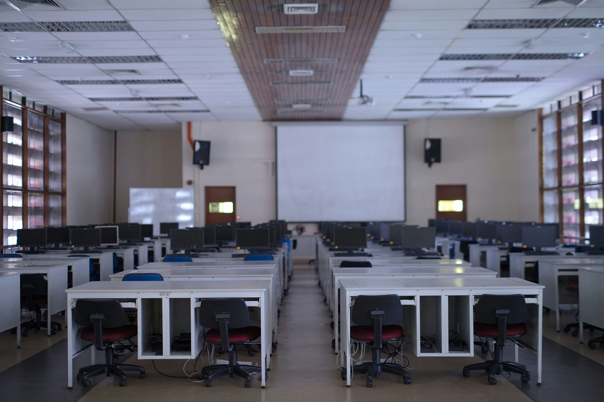 Empty classroom representing the policy void schools face with AI