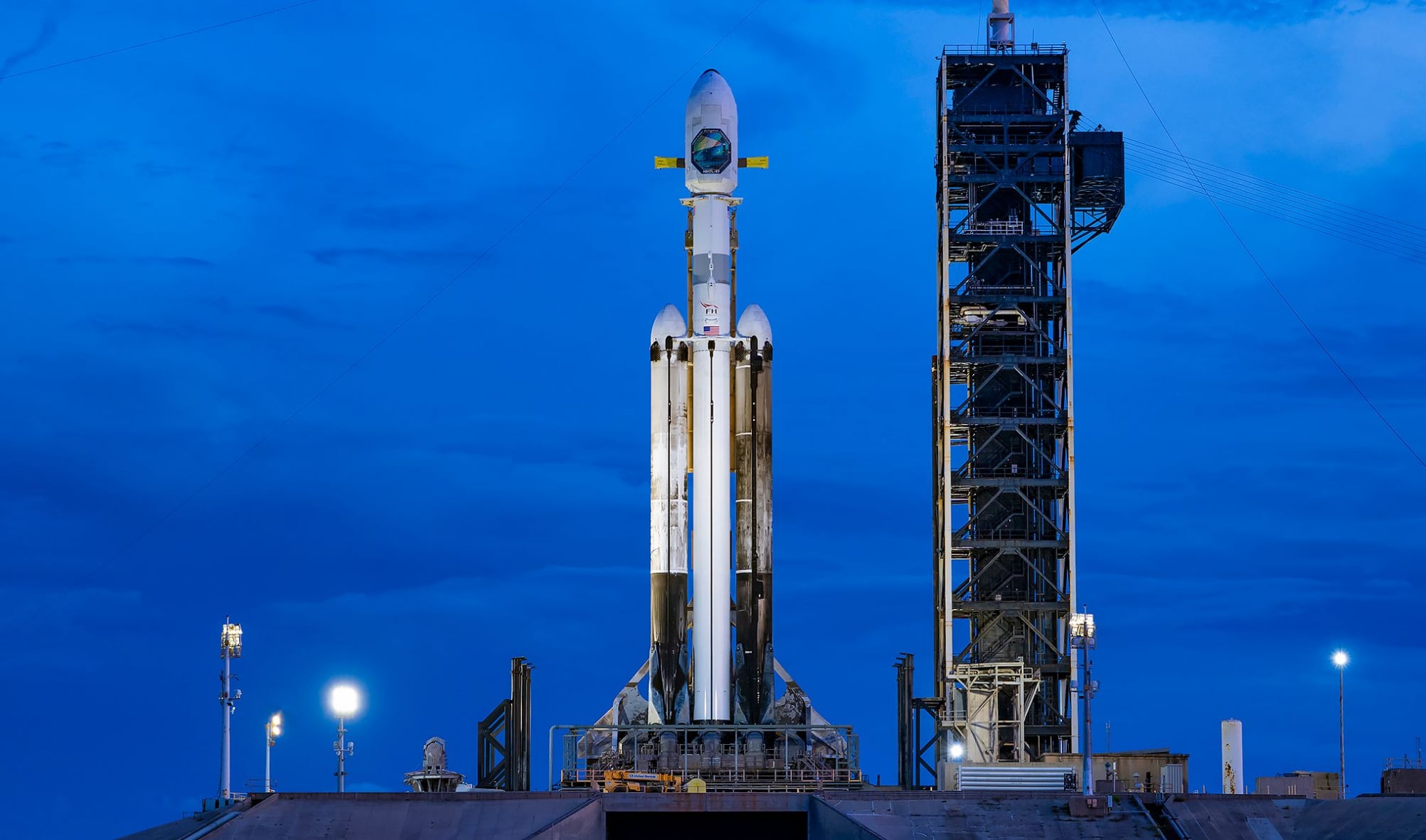 Falcon Heavy on LC-39A during pre-launch operations with sunset lighting