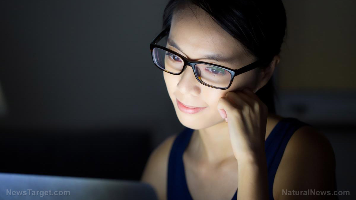 Woman at computer late at night exposed to blue light