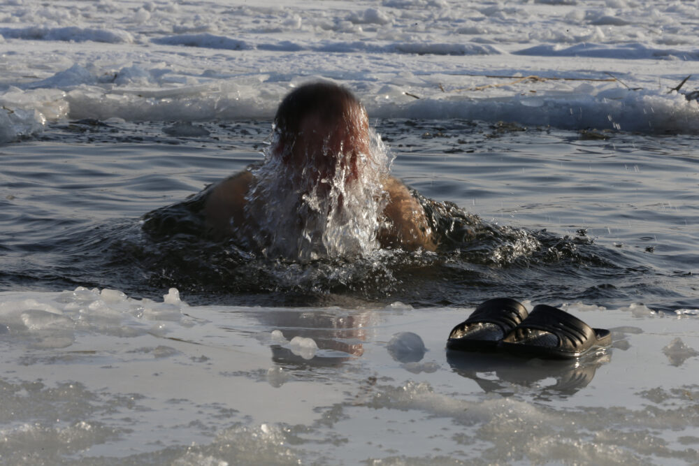 Athlete entering an ice bath for recovery