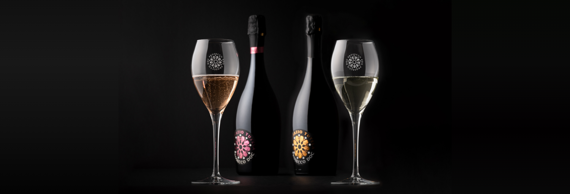 Prosecco bottles on Italian vineyard hillside