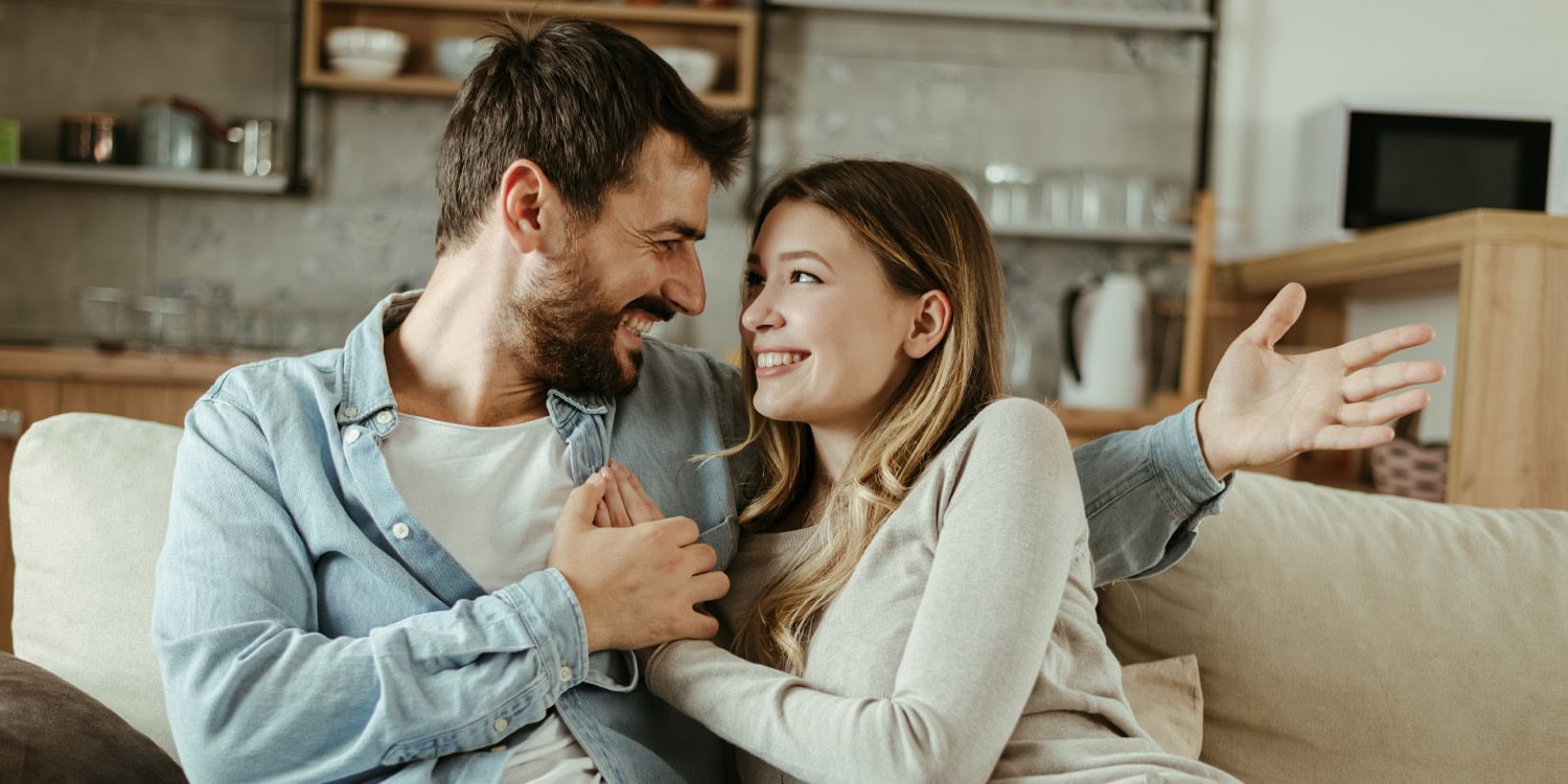Happy young couple discussing something