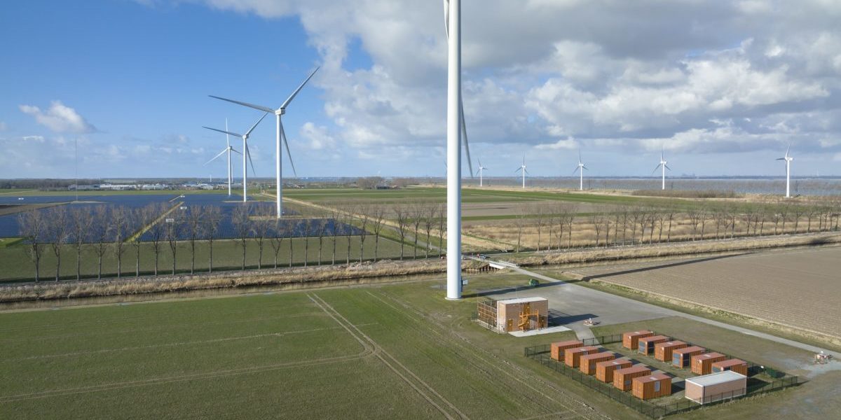 Wind turbines and solar panels representing the historic April 2026 milestone when renewables outpaced gas globally