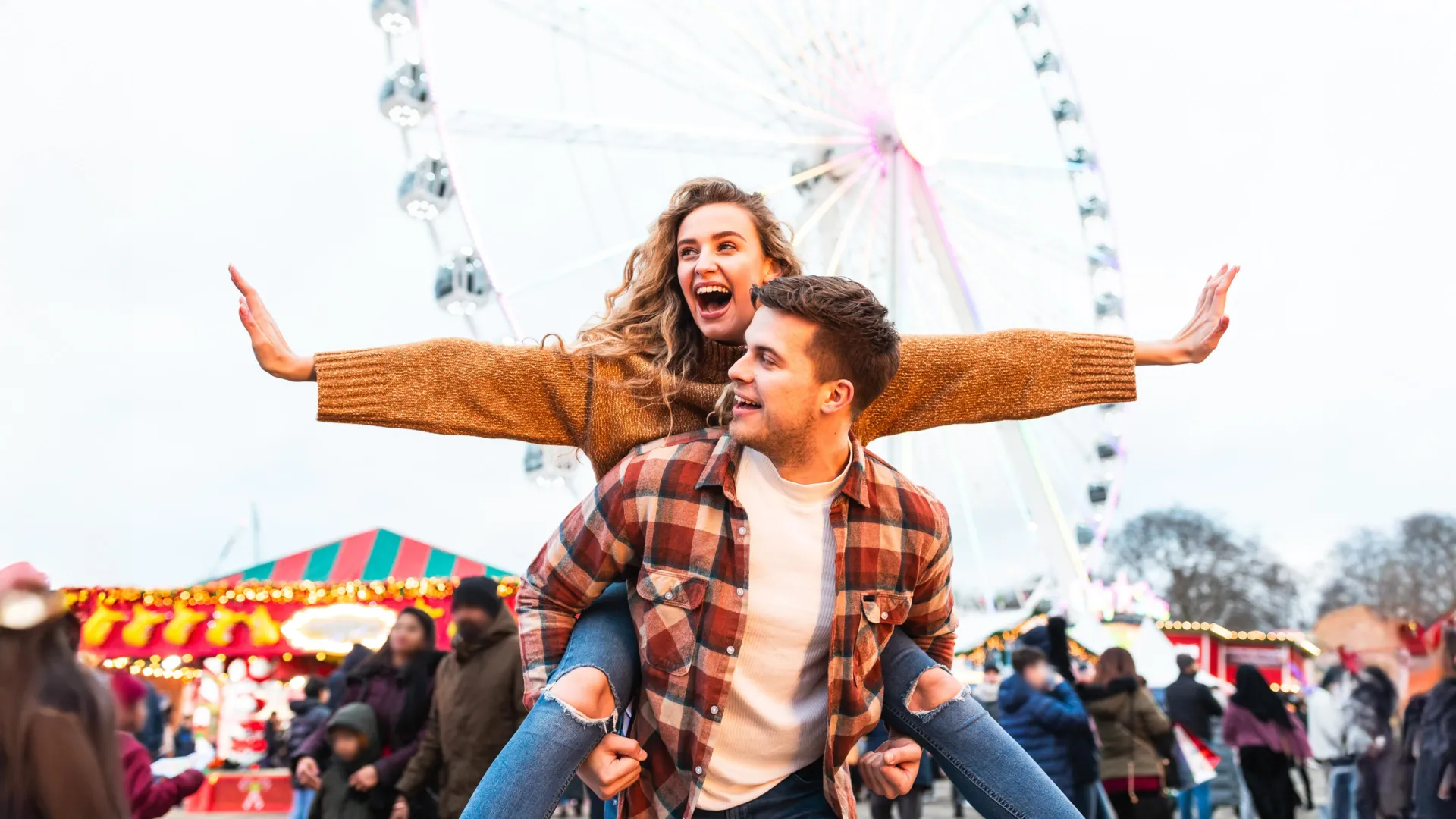 Happy couple savoring a moment together at an amusement park