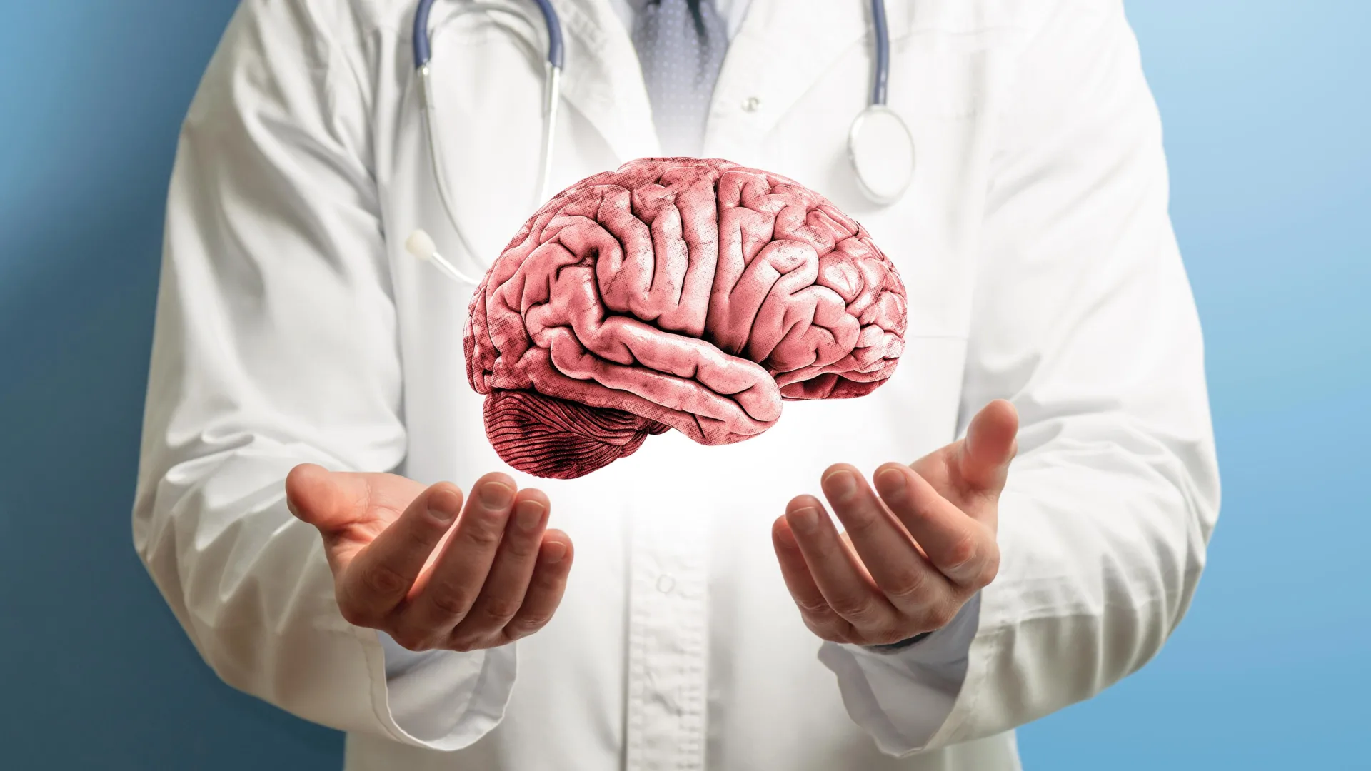 Doctor holding a model of a human brain for autism research