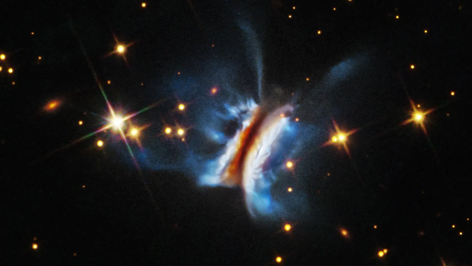 The Hubble image of IRAS 23077+6707, nicknamed "Dracula's Chivito" — a turbulent, lopsided planet-forming disk