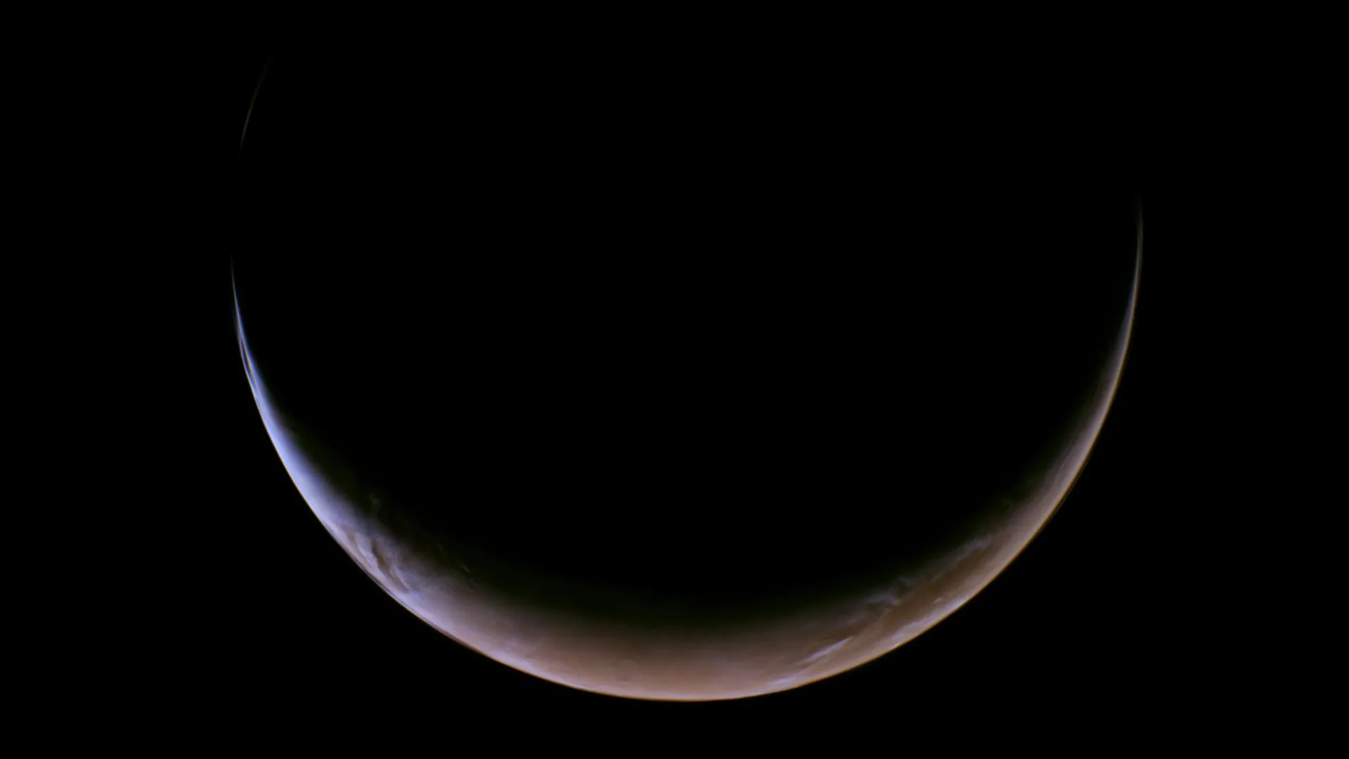NASA's Psyche spacecraft captured striking crescent images of Mars during its gravity-assist flyby