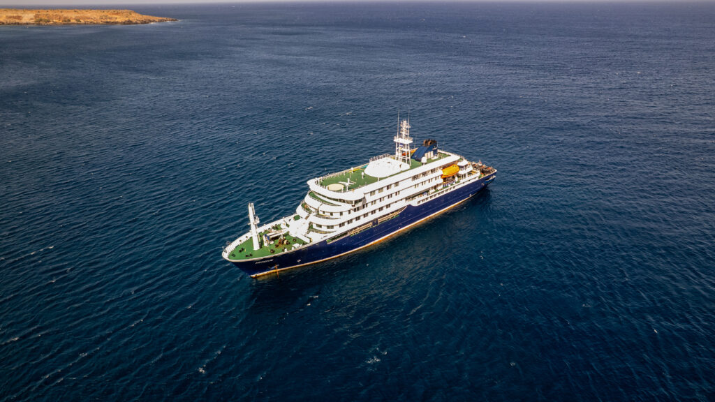 Passengers on a cruise ship deck with concern over hantavirus risk in the Atlantic