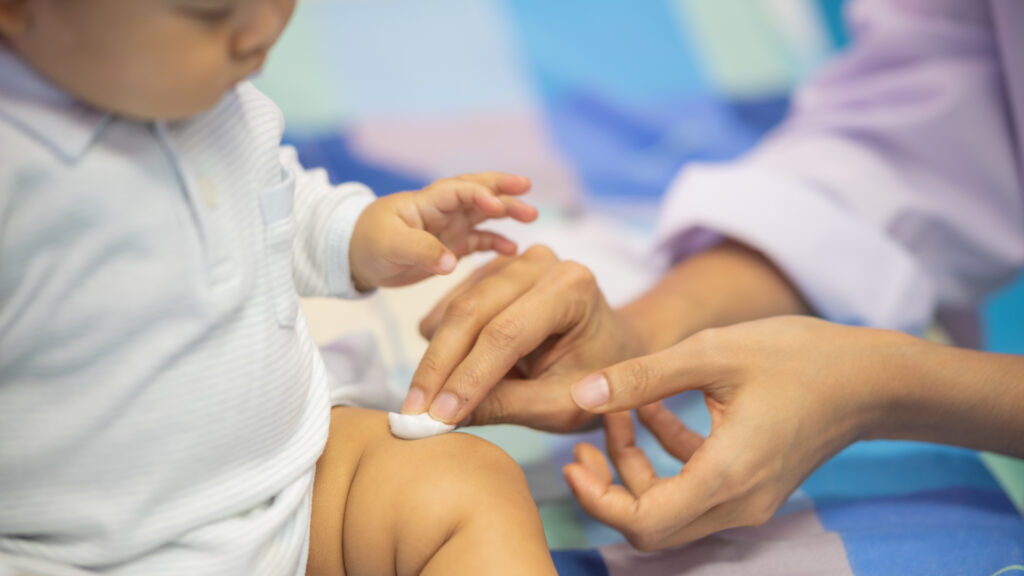Medical professionals discussing vaccine guidelines