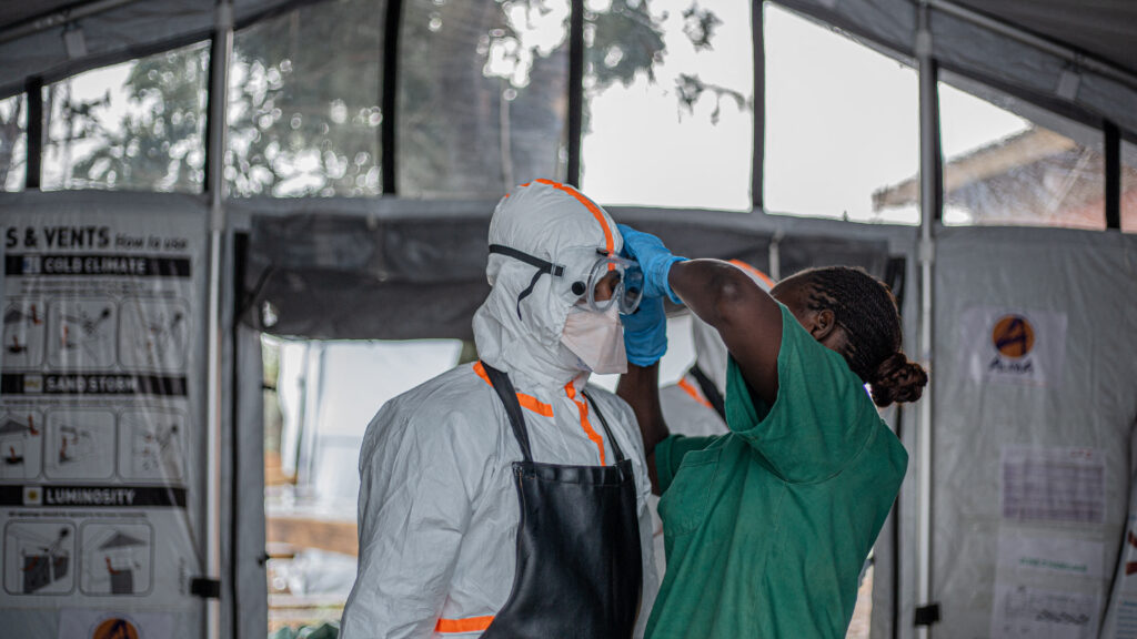 Health workers in protective gear during Ebola response