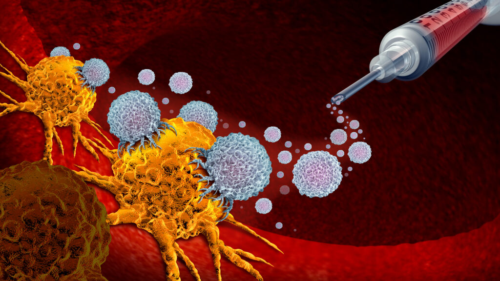 Researchers examining cancer vaccine data in laboratory setting