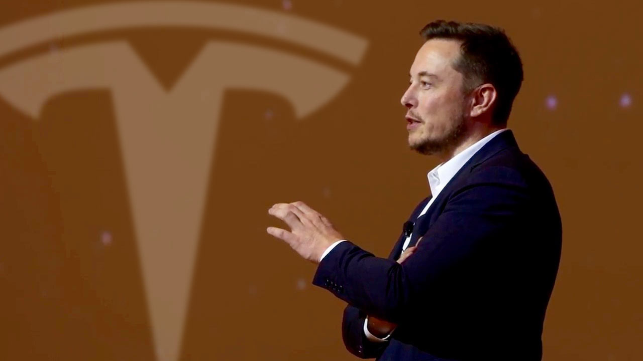 Elon Musk and Tesla corporate branding at headquarters