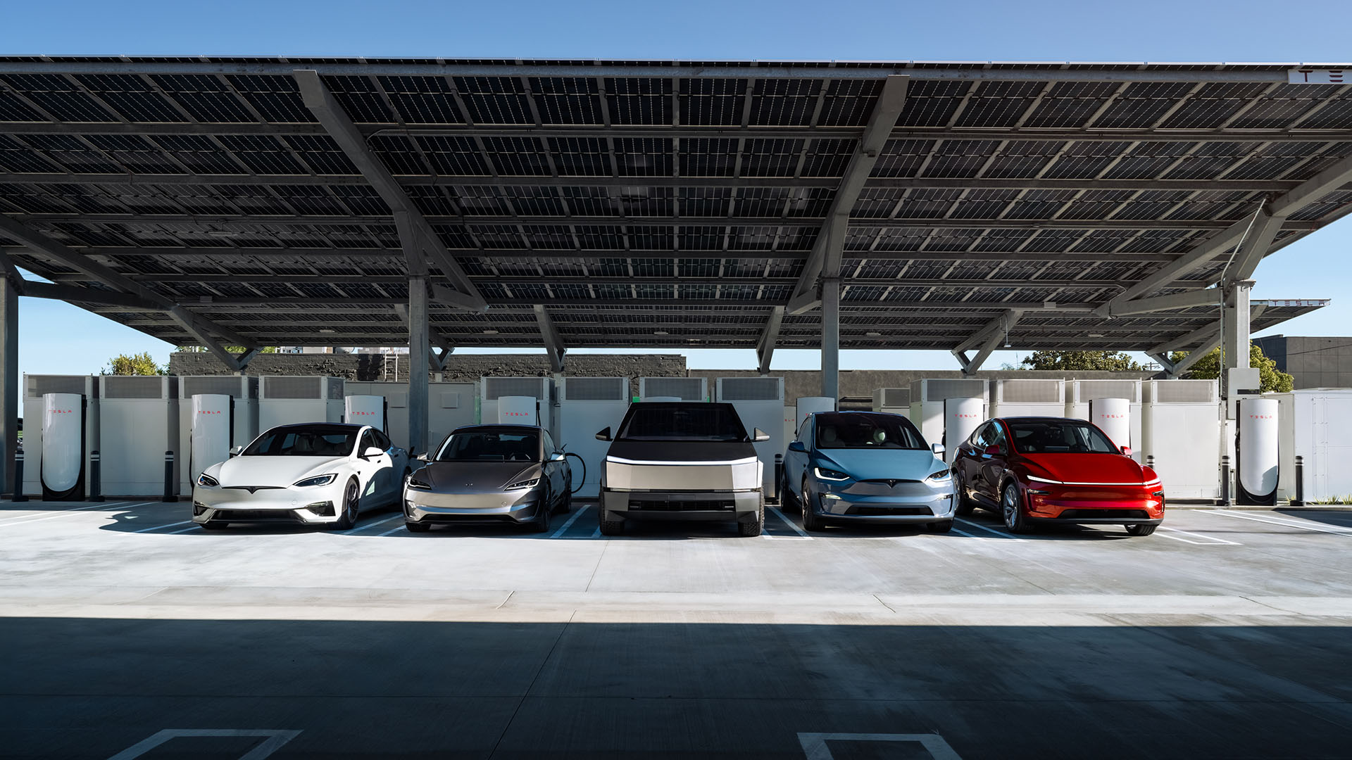 Tesla Model 3, Model Y and Cybercab lineup in parking formation