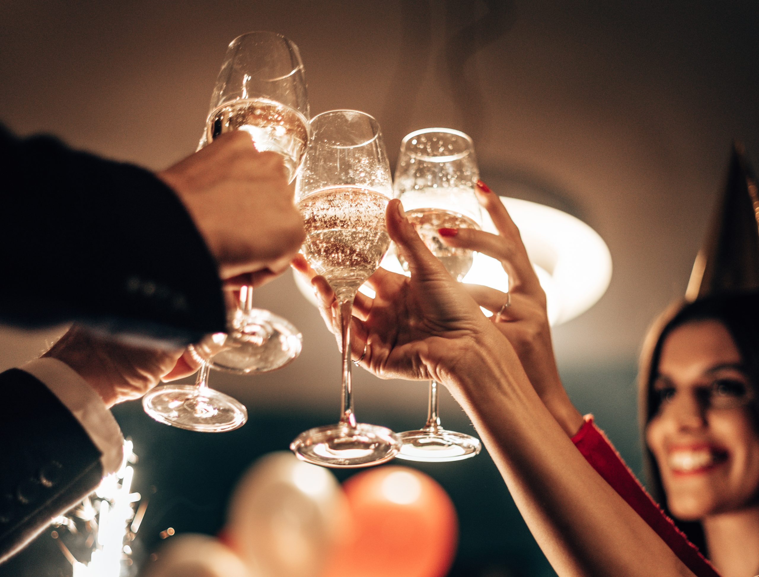 Champagne glasses raised in a celebratory toast, marking the reveal of The Drinks Business Awards 2026 shortlist