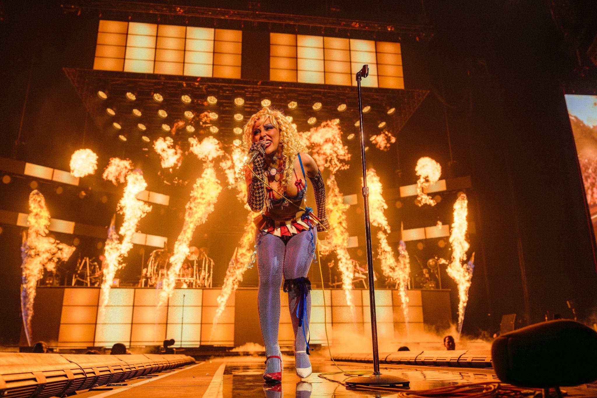 Doja Cat and Latto performing on stage during a concert