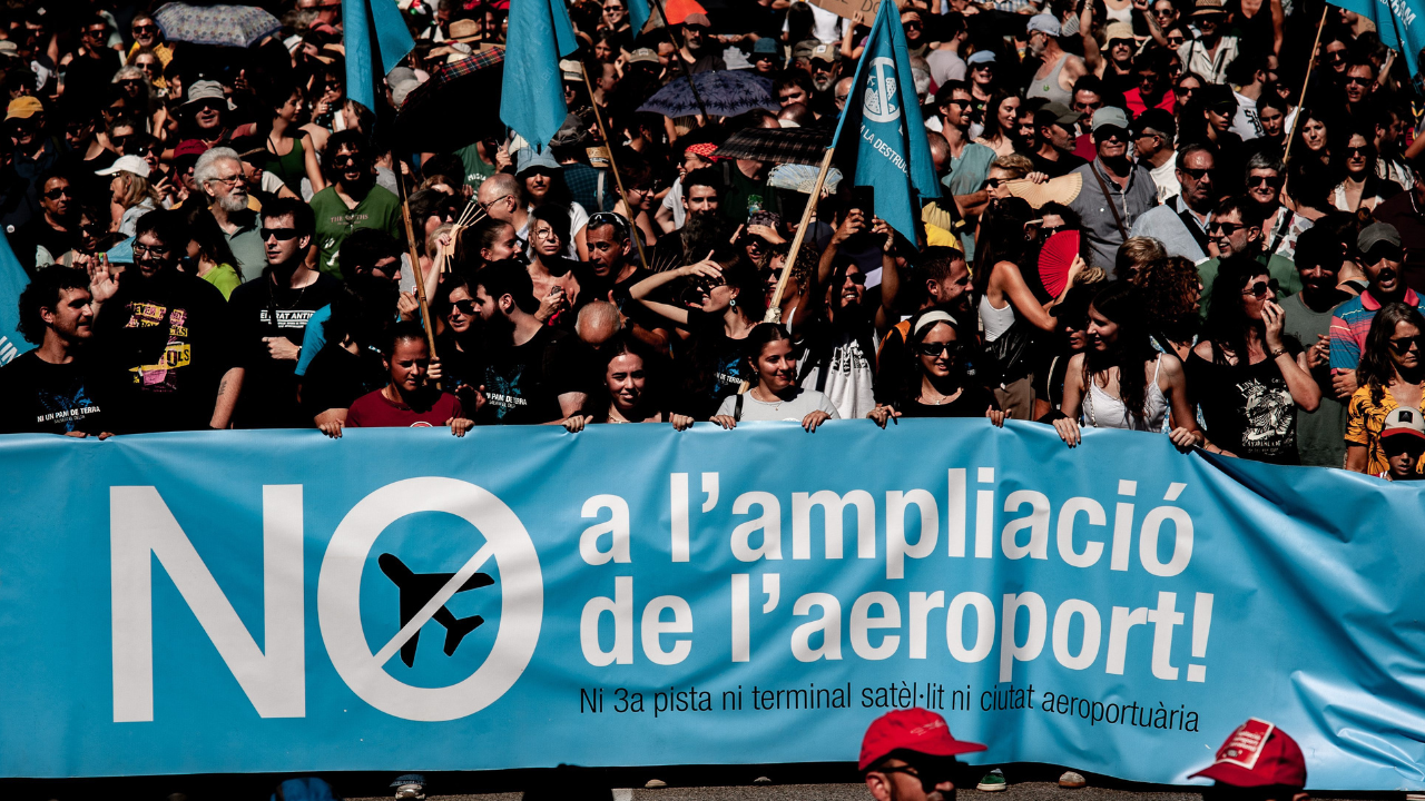 Protesters march against airport expansion and mass tourism in Spain