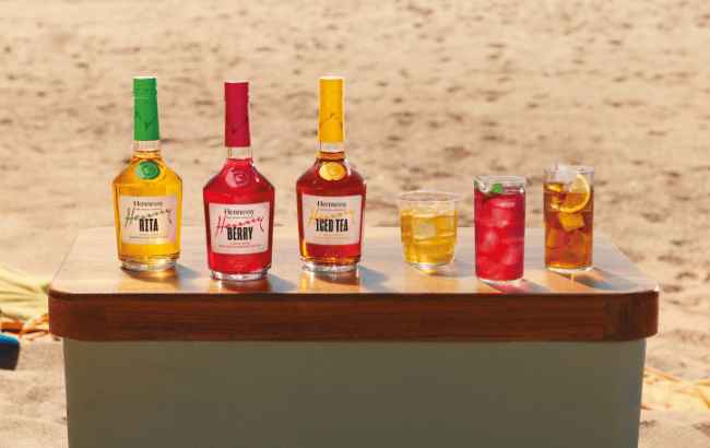Hennessy bottles displayed against a dark background
