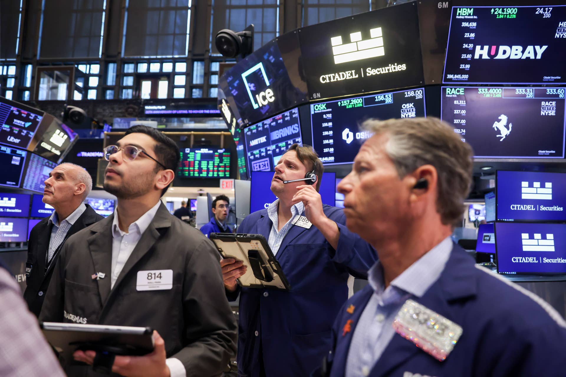 Traders react to market volatility on the New York Stock Exchange floor