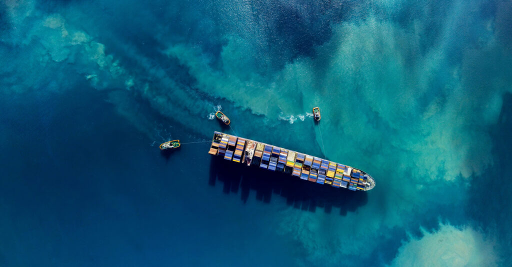 Container ship navigating through a canal